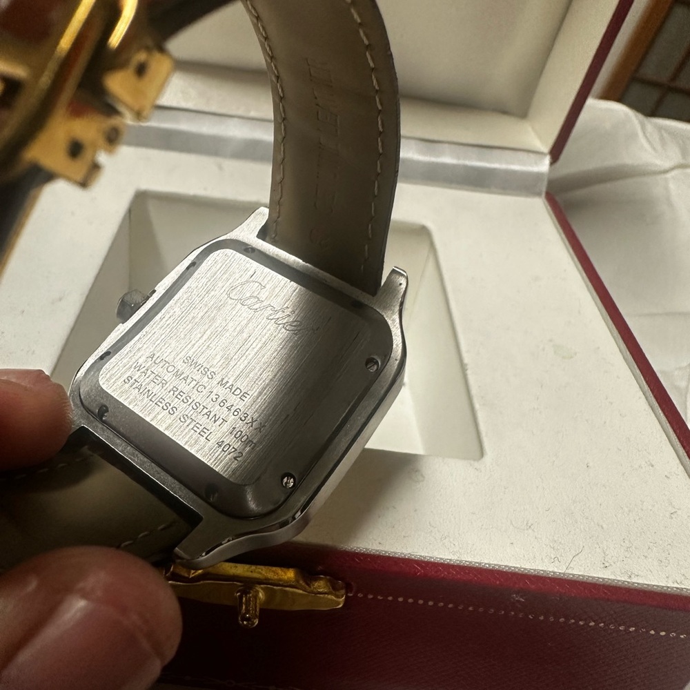 Town tone Cartier Santos. Comes with steel bracelet as well and box.